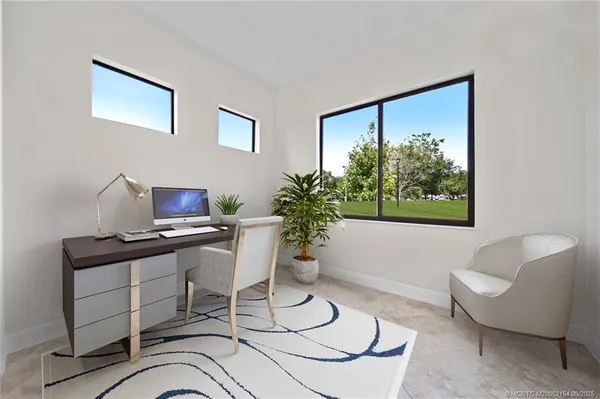 a workspace with furniture and a window