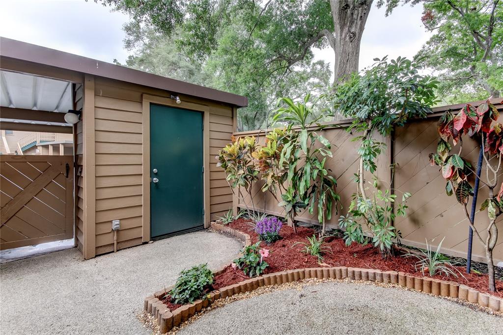 WELCOME HOME!! FRONT PATIO / COURTYARD AREA WITH STORAGE SHED!