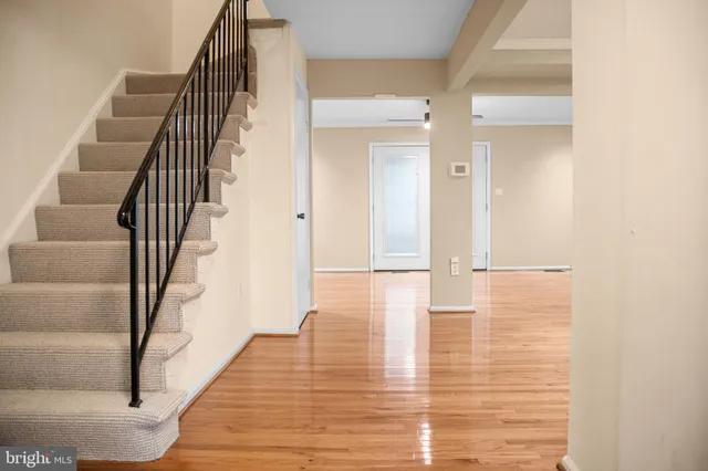 a view of an entryway with wooden floor