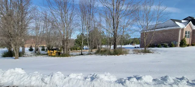 a view of road with a building in the background