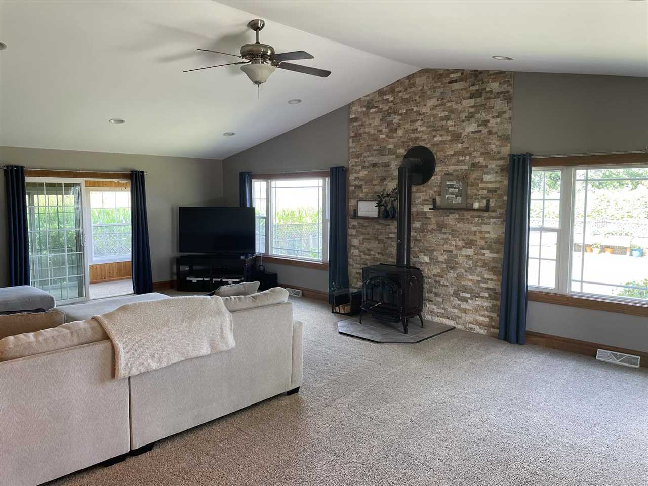 9474 Marengo Road Garden Prairie, IL 61038 - Photo 11 of 31 a living room with furniture and a flat screen tv