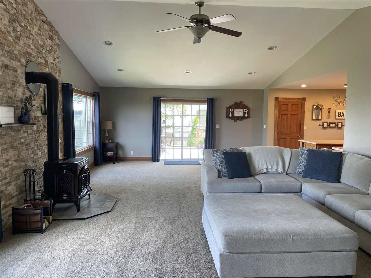9474 Marengo Road Garden Prairie, IL 61038 - Photo 12 of 31 a living room with furniture and a flat screen tv