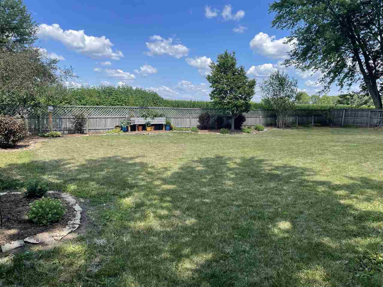 9474 Marengo Road Garden Prairie, IL 61038 - Photo 28 of 31 a backyard of a house with lots of green space