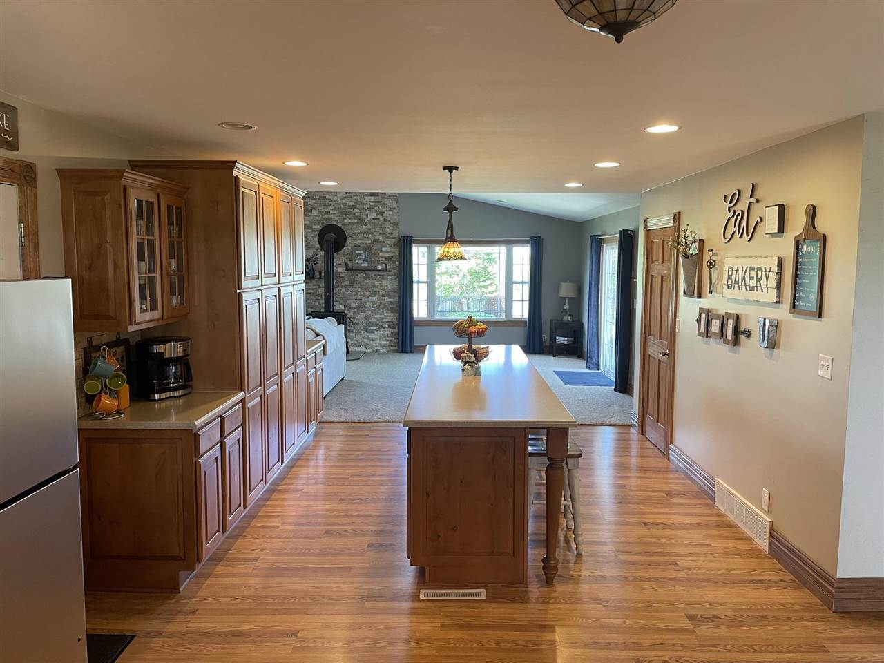 9474 Marengo Road Garden Prairie, IL 61038 - Photo 8 of 31 a large kitchen with stainless steel appliances wooden floor and large windows