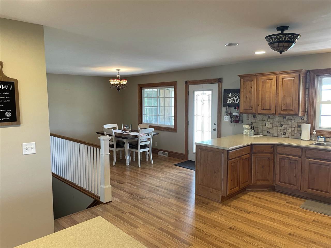 9474 Marengo Road Garden Prairie, IL 61038 - Photo 10 of 31 a large living room with stainless steel appliances granite countertop furniture a fireplace and a large window