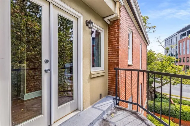a view of a balcony with wooden floor