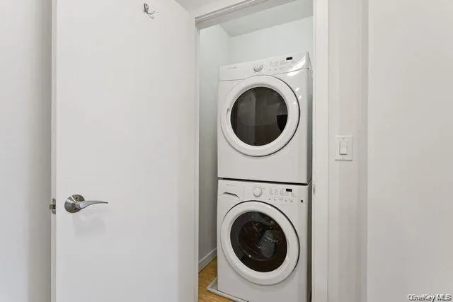 a view of a hallway with washer and dryer