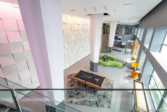 a room with furniture and air hockey table