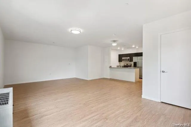 a view of kitchen with wooden floor