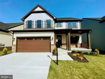 a front view of a house with yard