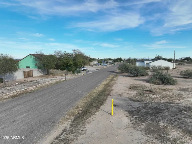 a view of a road with a building in the background