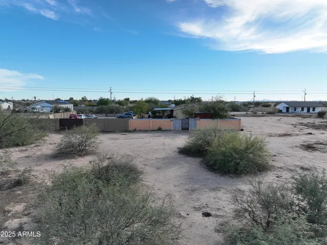 a view of a lake with houses in back