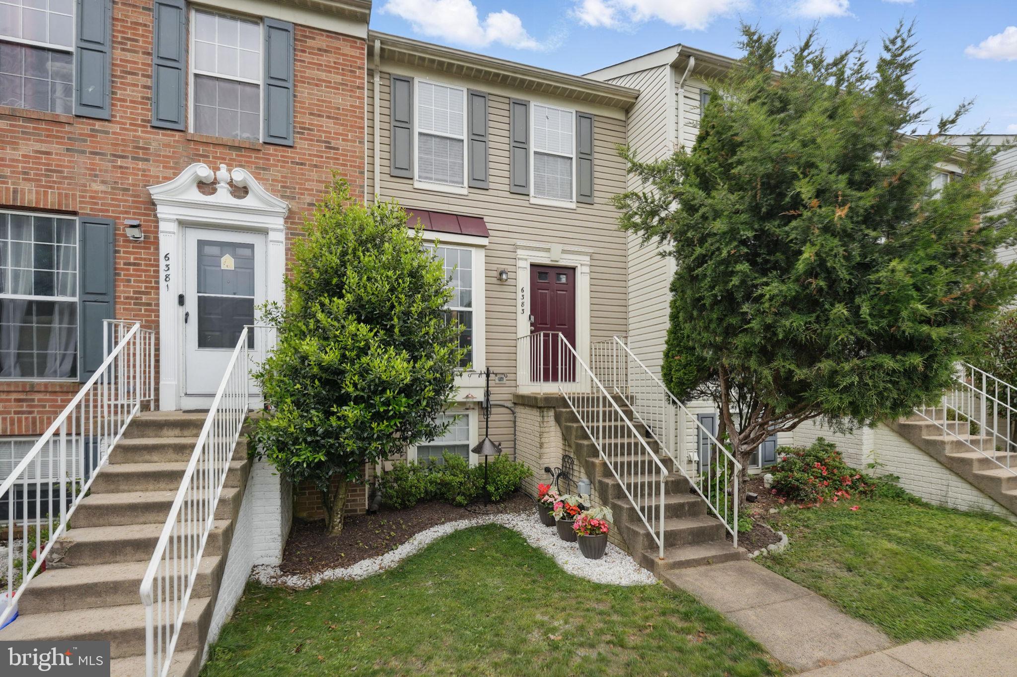 6383 Michael Robert Drive Springfield, VA 22150 - Photo 1 of 29 a view of a house with backyard and a garden
