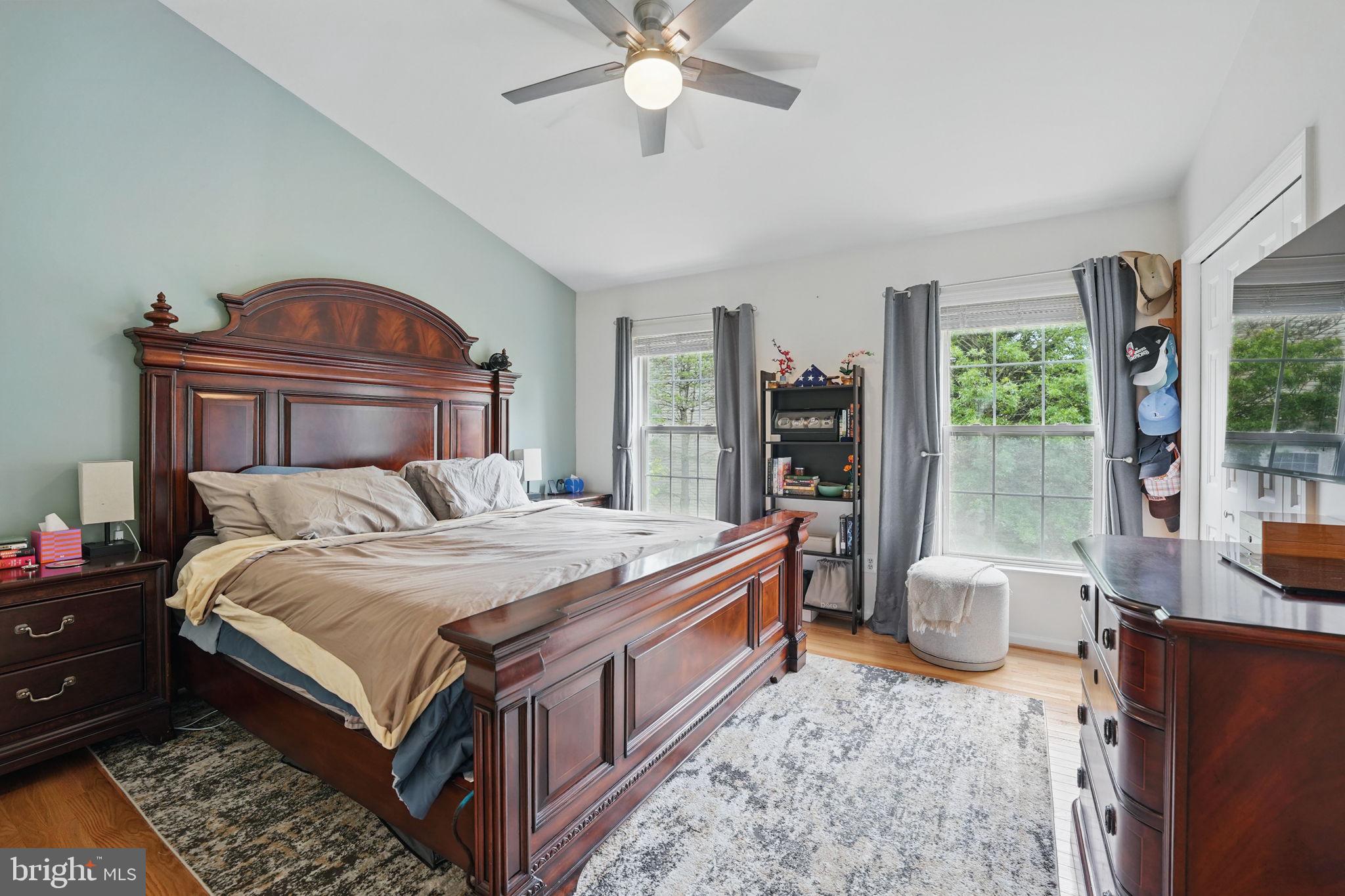 6383 Michael Robert Drive Springfield, VA 22150 - Photo 12 of 29 a bedroom with a bed and a chandelier