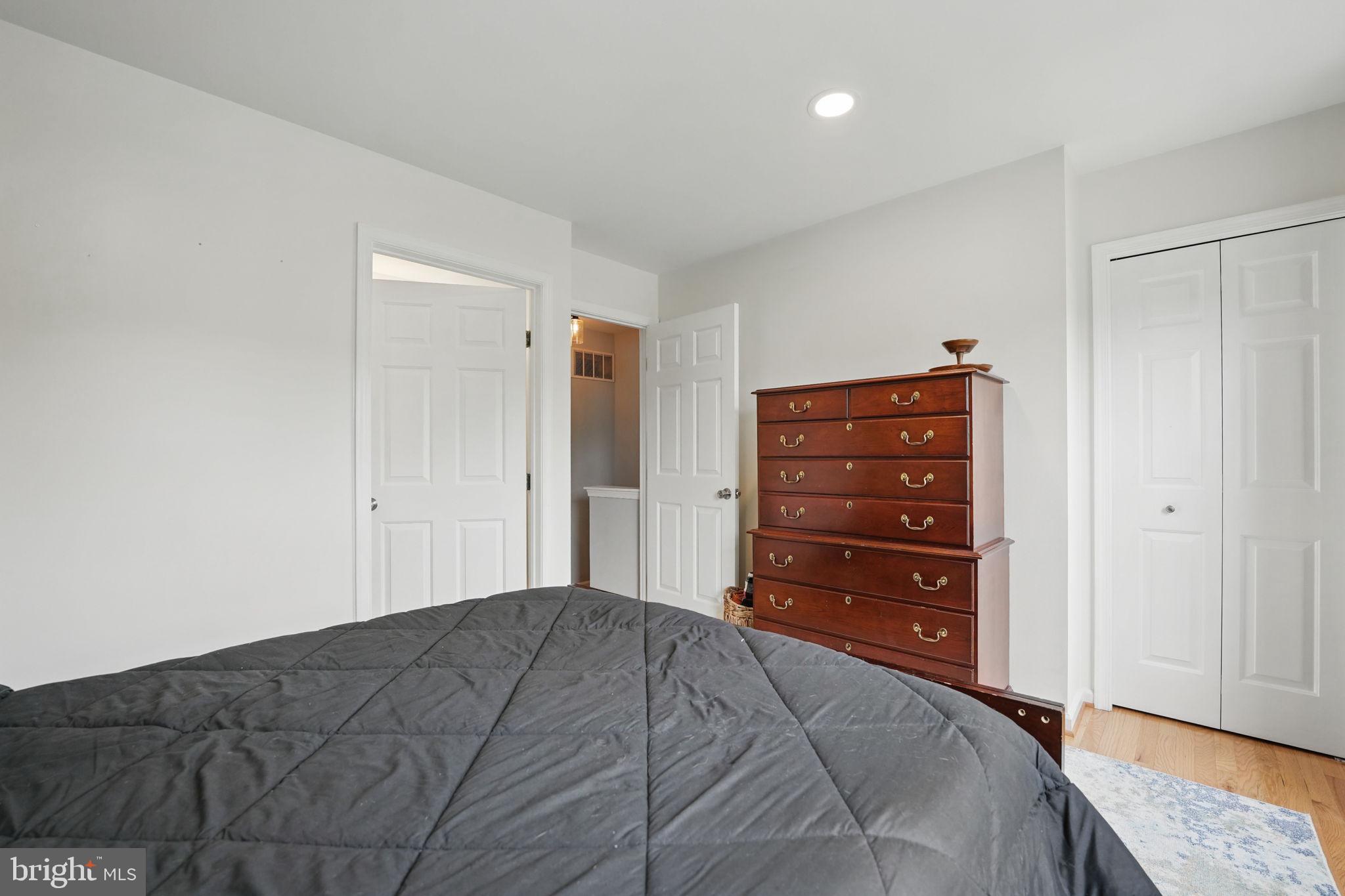 6383 Michael Robert Drive Springfield, VA 22150 - Photo 16 of 29 a bedroom with a bed and a dresser