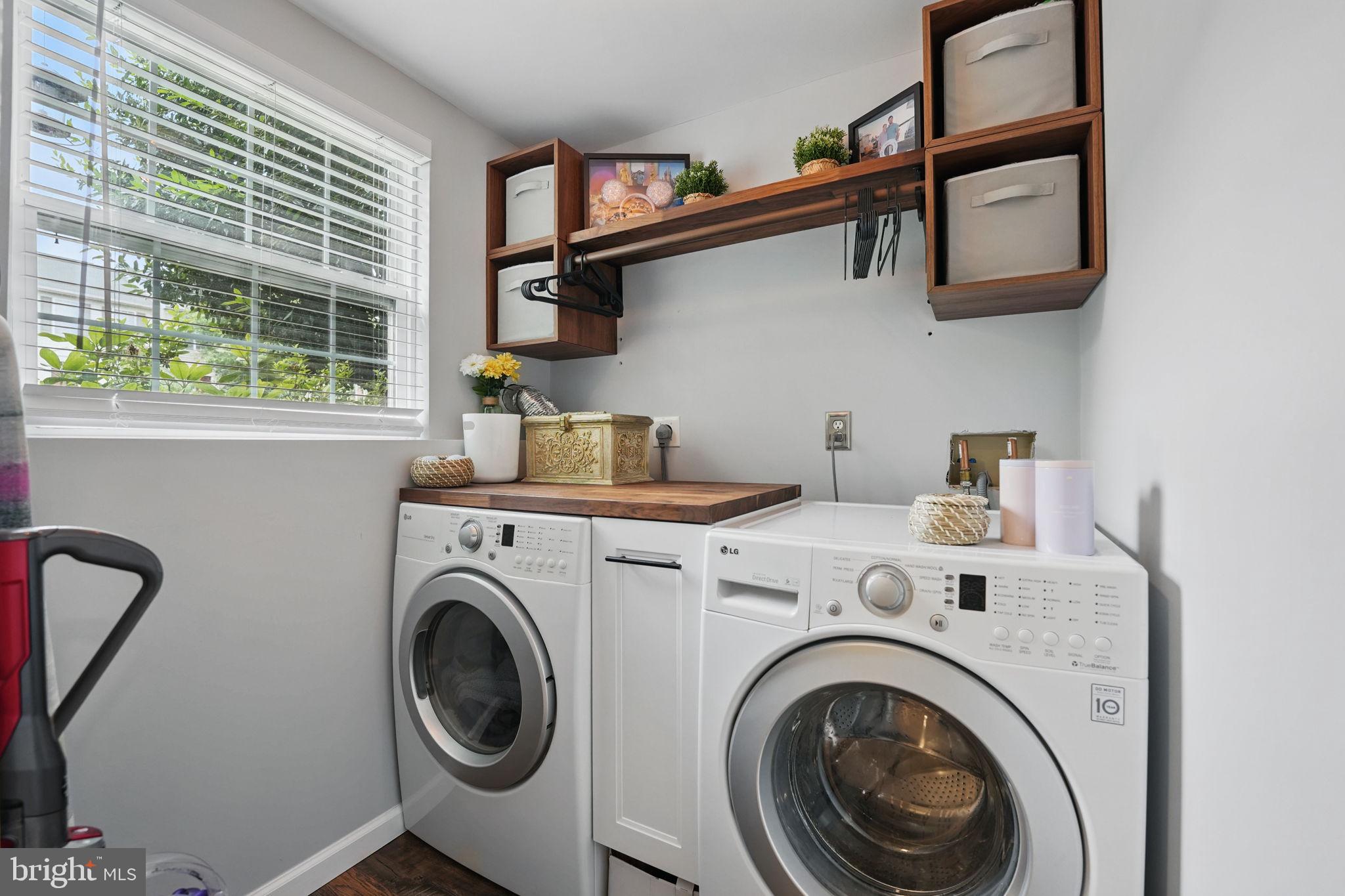 6383 Michael Robert Drive Springfield, VA 22150 - Photo 19 of 29 a utility room with dryer and washer