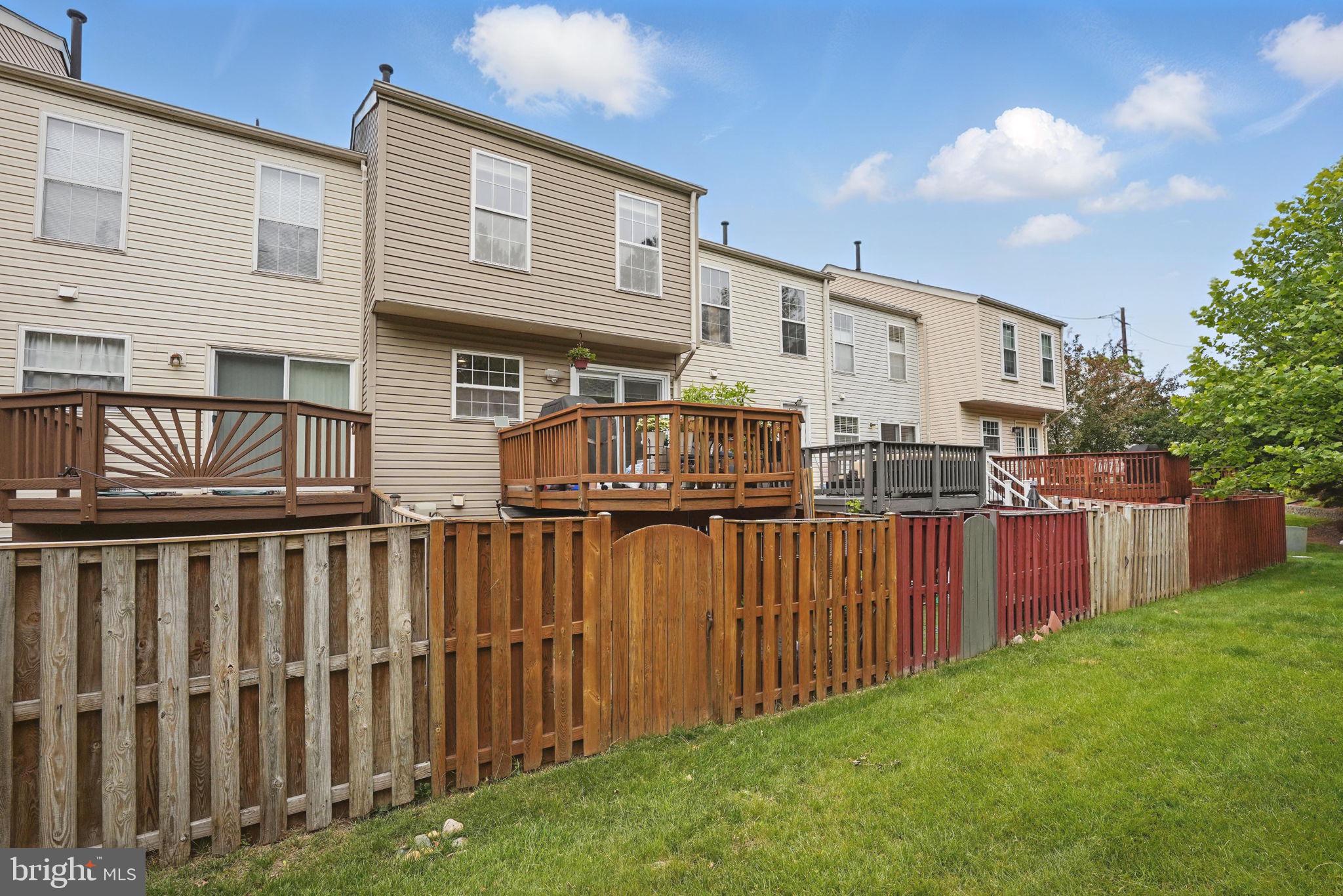 6383 Michael Robert Drive Springfield, VA 22150 - Photo 25 of 29 a view of a house with backyard and deck