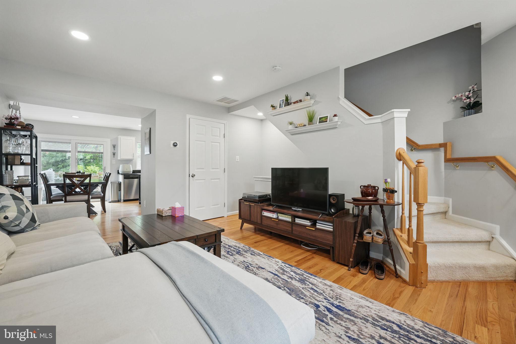 6383 Michael Robert Drive Springfield, VA 22150 - Photo 3 of 29 a bedroom with furniture and a flat screen tv