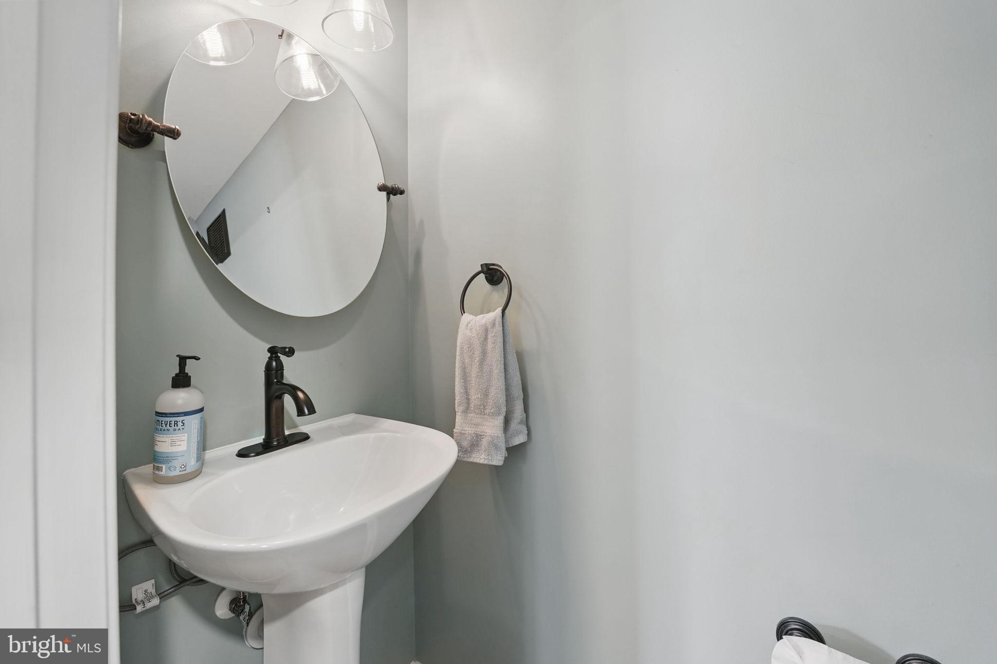 6383 Michael Robert Drive Springfield, VA 22150 - Photo 5 of 29 a bathroom with a sink and mirror