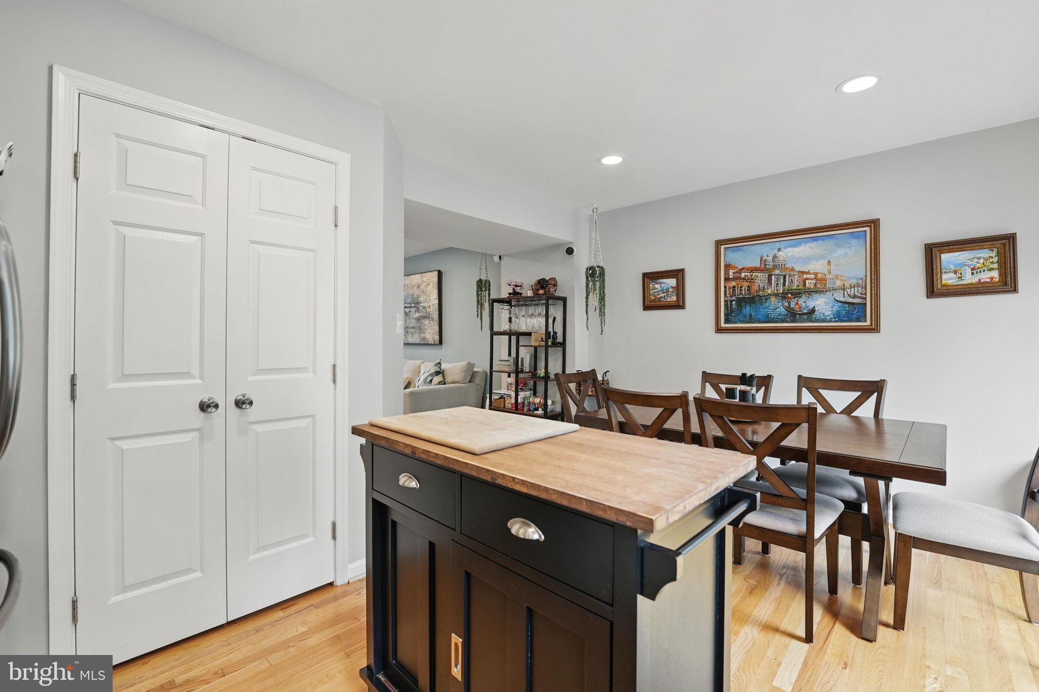 6383 Michael Robert Drive Springfield, VA 22150 - Photo 9 of 29 a view of a dining area with furniture and wooden floor