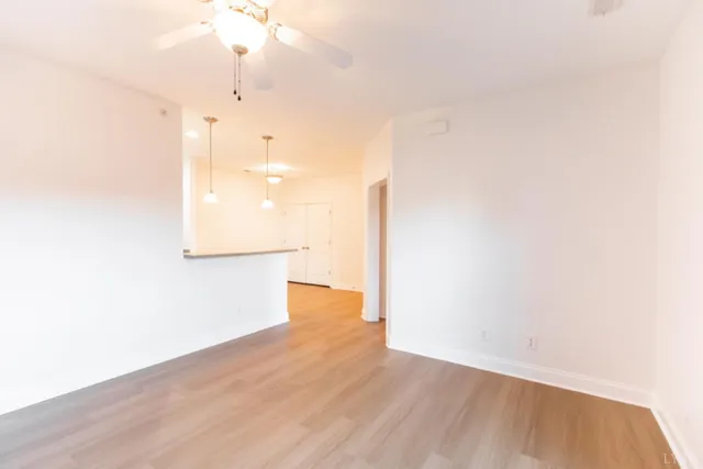 a view of a kitchen with wooden floor