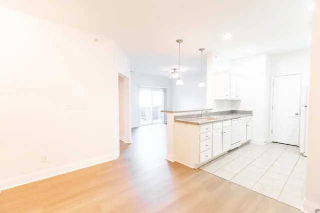 a view of a livingroom with wooden floor