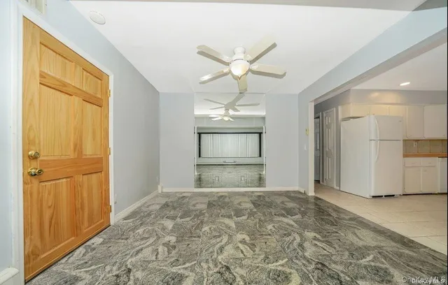 a view of an empty room with a window