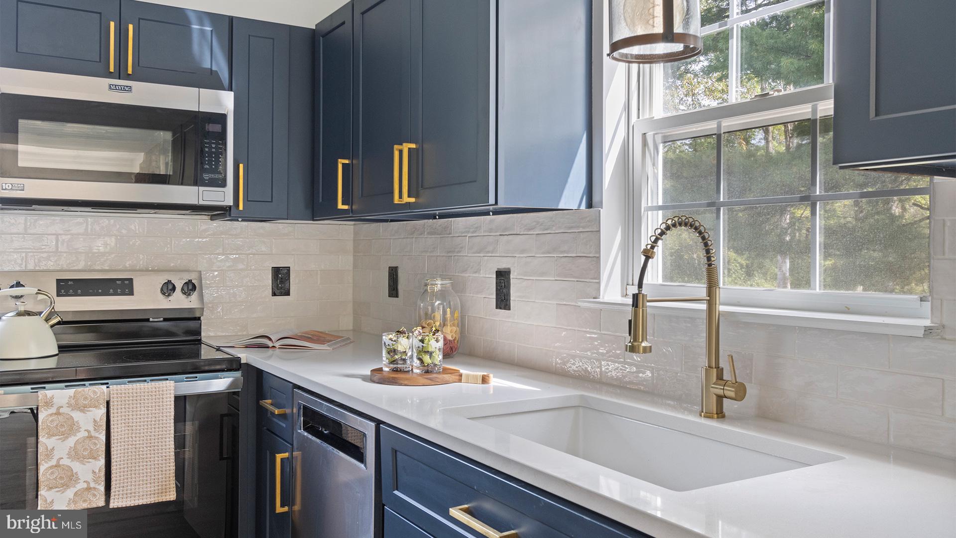 739 Company Farm Road Aspers, PA 17304 - Photo 12 of 45 a kitchen with a sink and a stove top oven