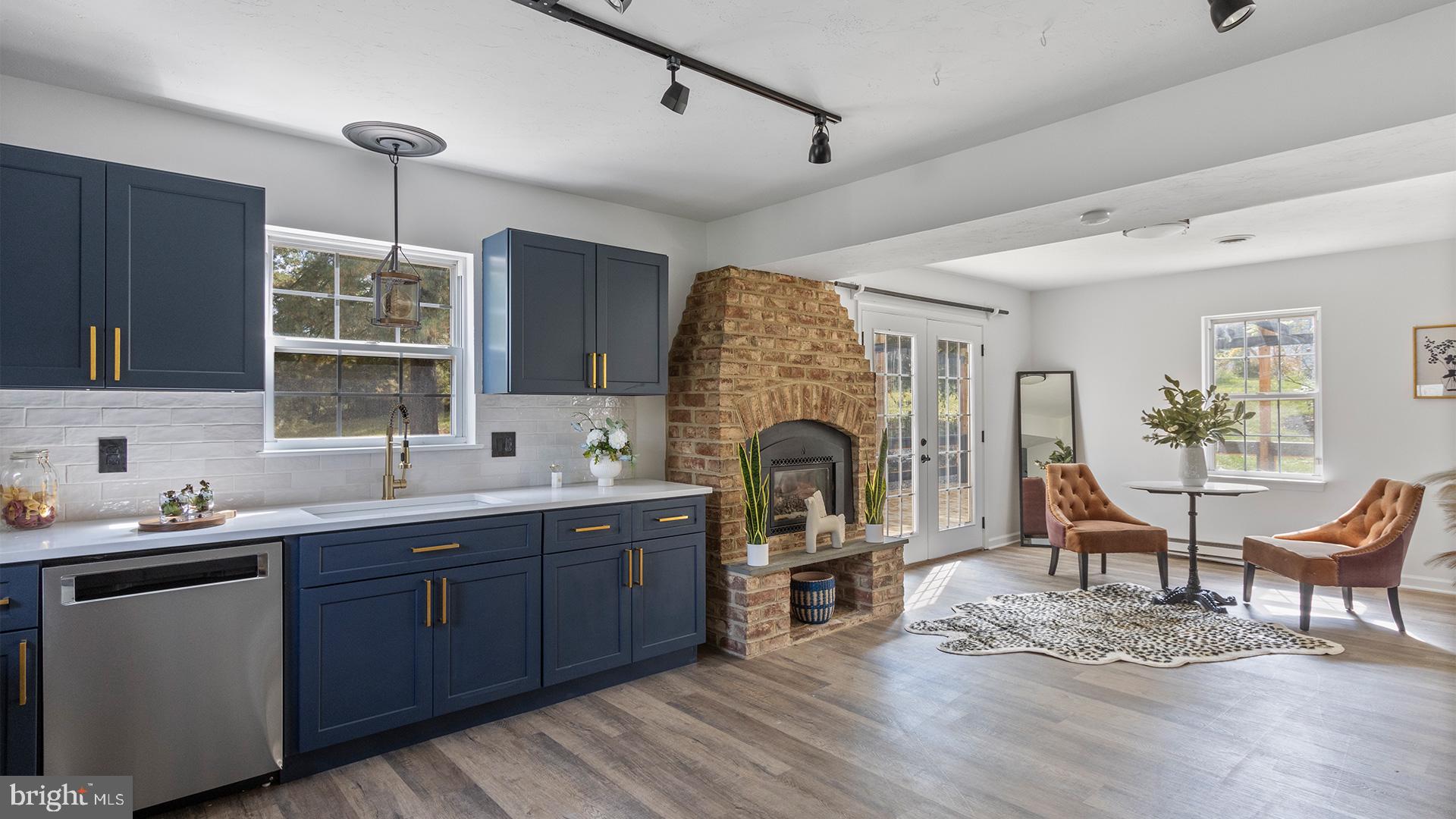 739 Company Farm Road Aspers, PA 17304 - Photo 13 of 45 a living room with furniture a flat screen tv and kitchen view