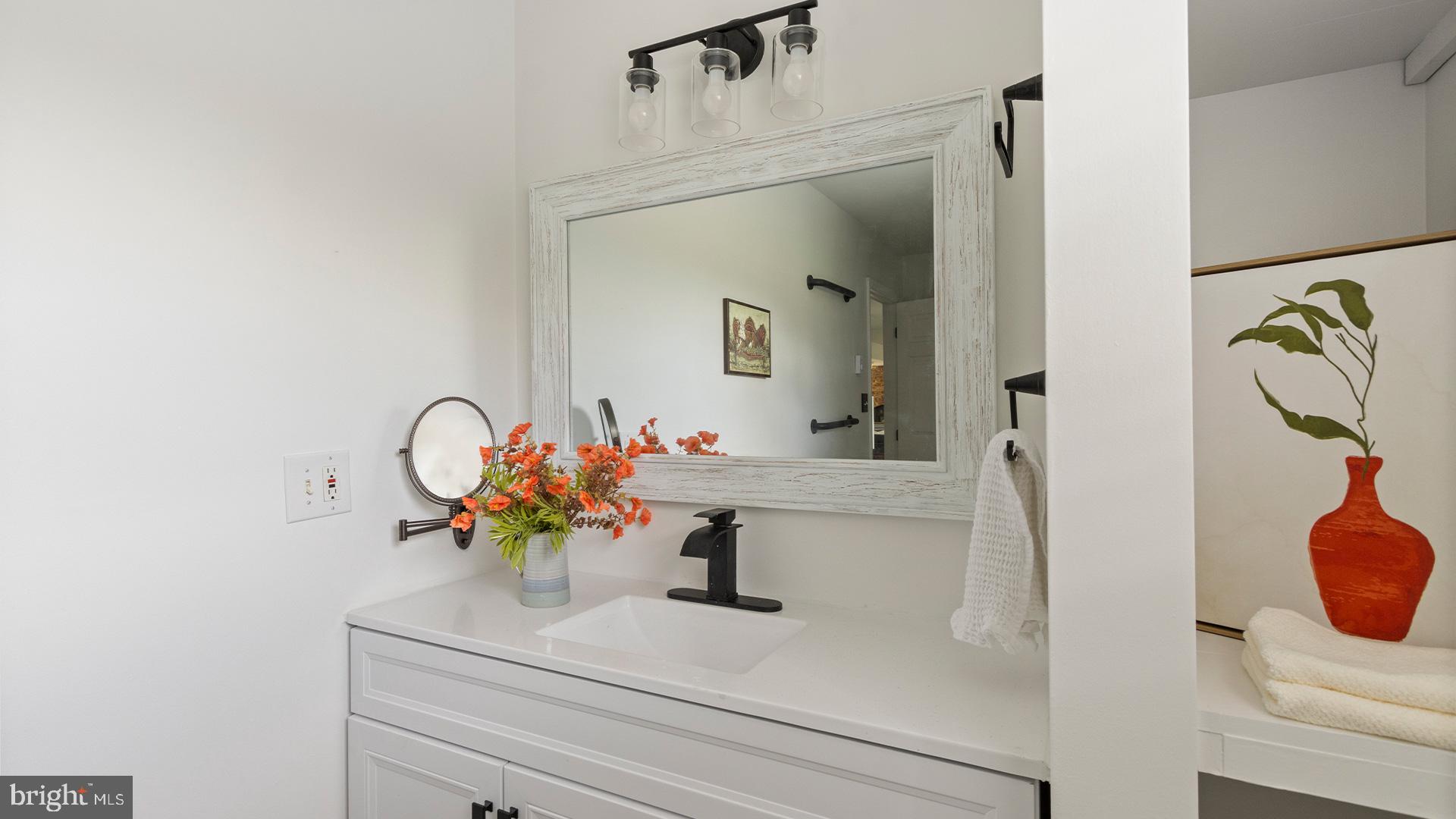 739 Company Farm Road Aspers, PA 17304 - Photo 24 of 45 a bathroom with a sink mirror and vanity