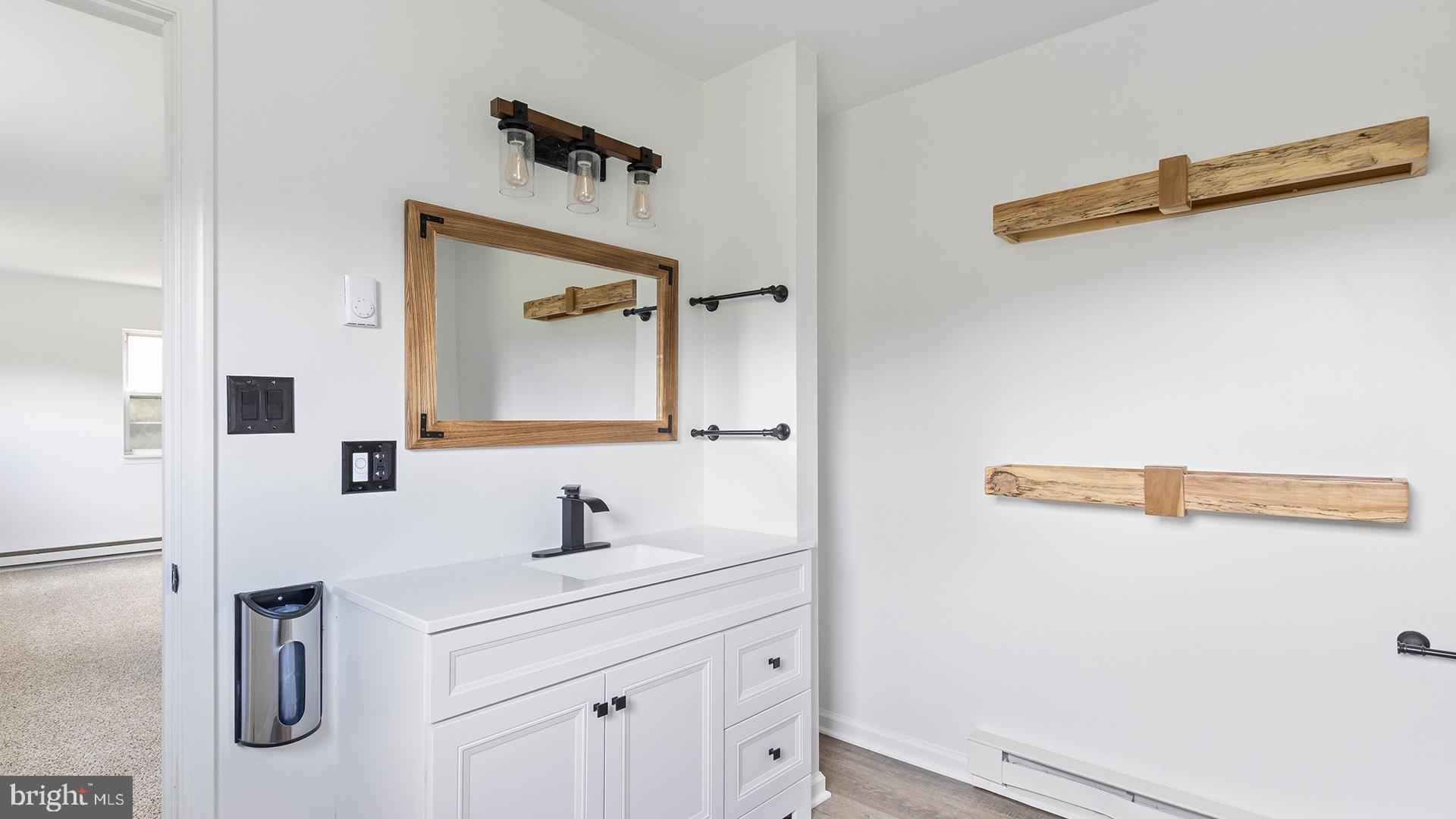 739 Company Farm Road Aspers, PA 17304 - Photo 27 of 45 a bathroom with a sink and mirror