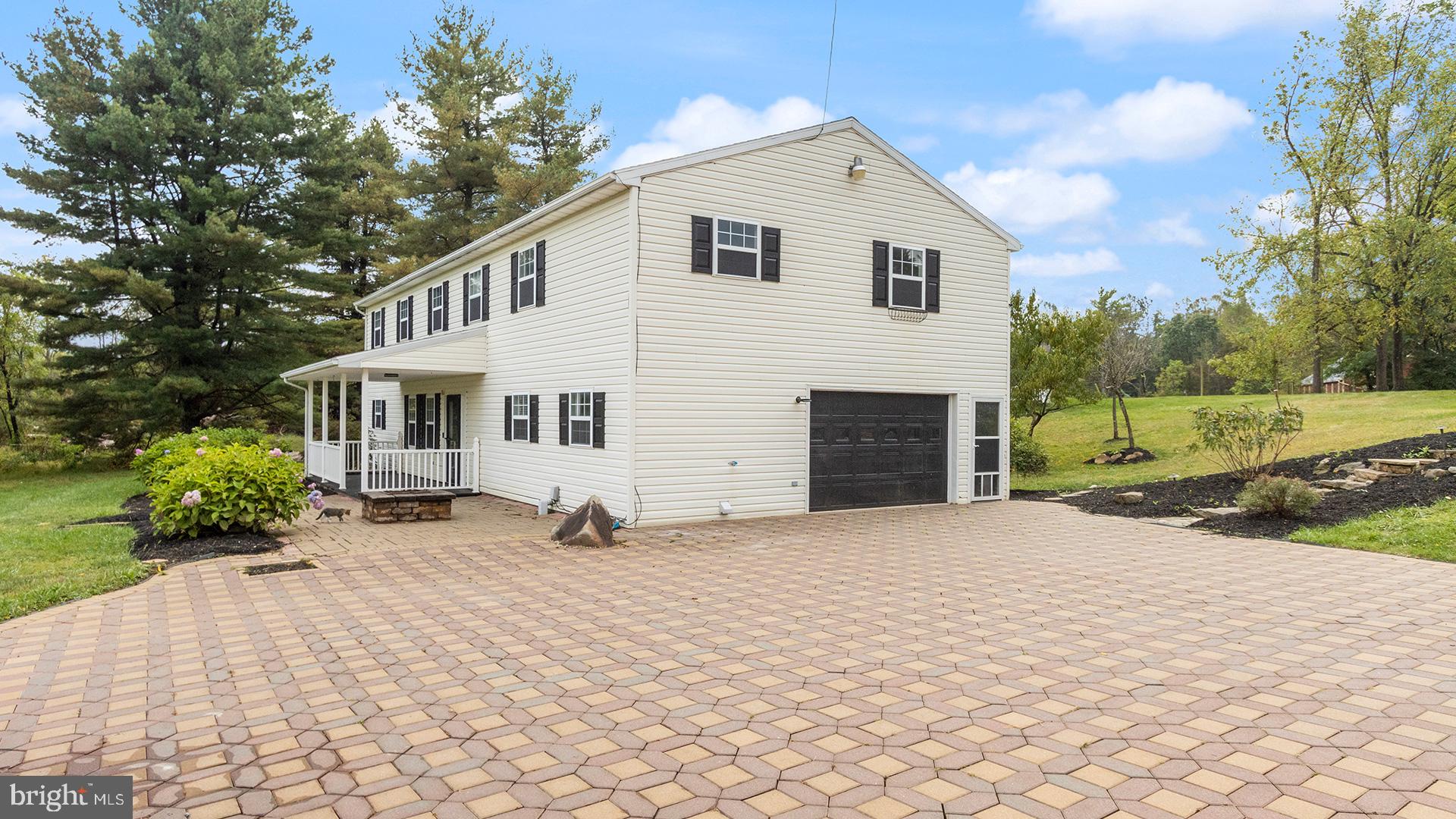 739 Company Farm Road Aspers, PA 17304 - Photo 3 of 45 a front view of a house with a yard and garage