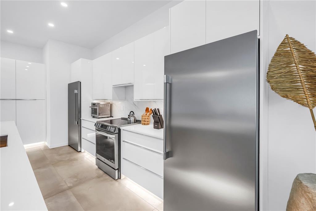 2314 Floyd Street Sarasota, FL 34239 - Photo 16 of 90 a kitchen with stainless steel appliances granite countertop a refrigerator and a stove
