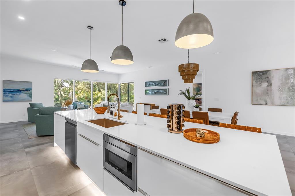 2314 Floyd Street Sarasota, FL 34239 - Photo 17 of 90 a kitchen with sink a stove and chairs