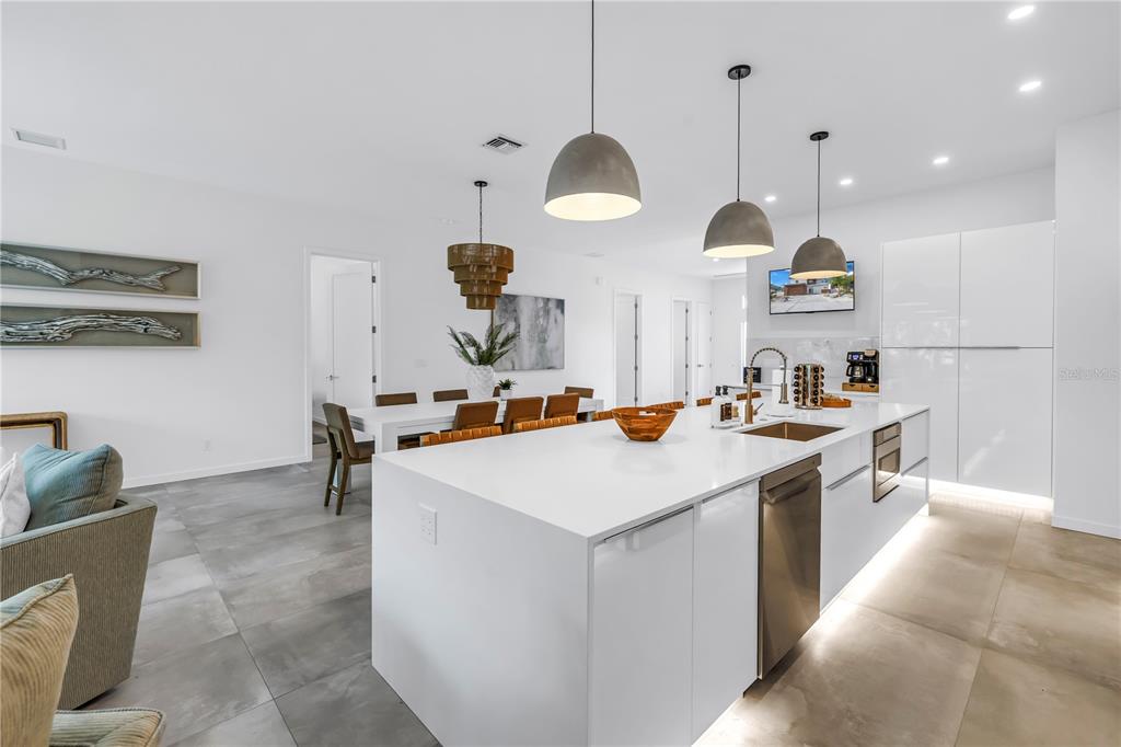 2314 Floyd Street Sarasota, FL 34239 - Photo 18 of 90 a kitchen with stainless steel appliances a stove a sink a chimney and a refrigerator