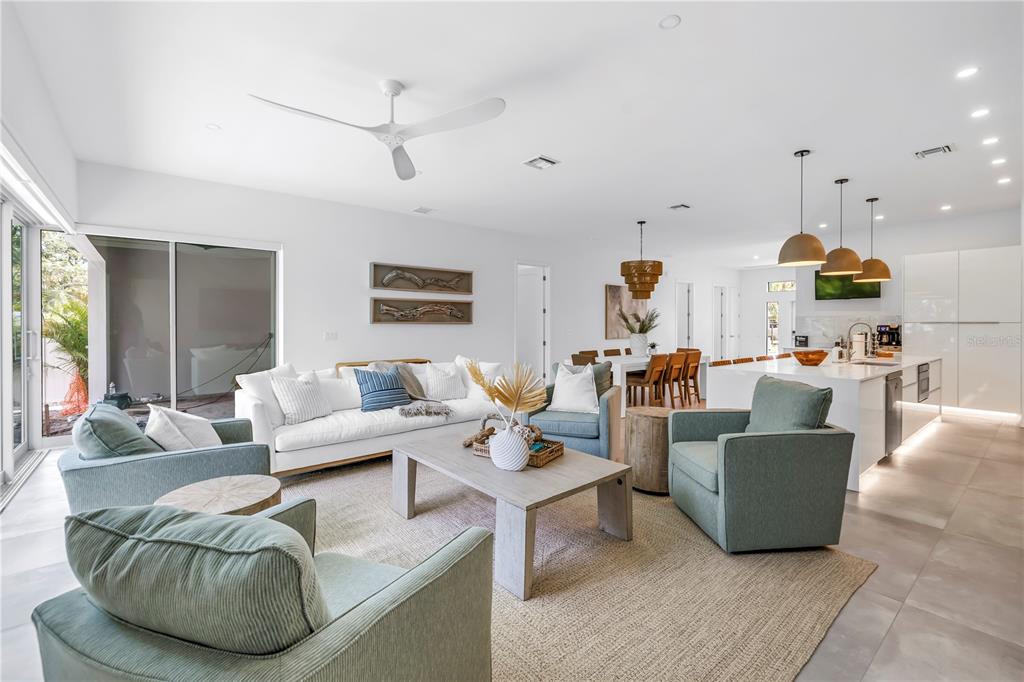 2314 Floyd Street Sarasota, FL 34239 - Photo 22 of 90 a living room with furniture kitchen view and a chandelier