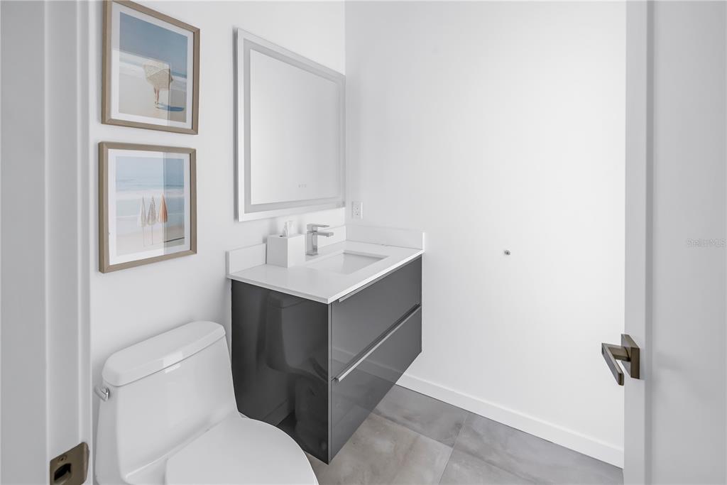 2314 Floyd Street Sarasota, FL 34239 - Photo 25 of 90 a bathroom with a sink toilet and mirror