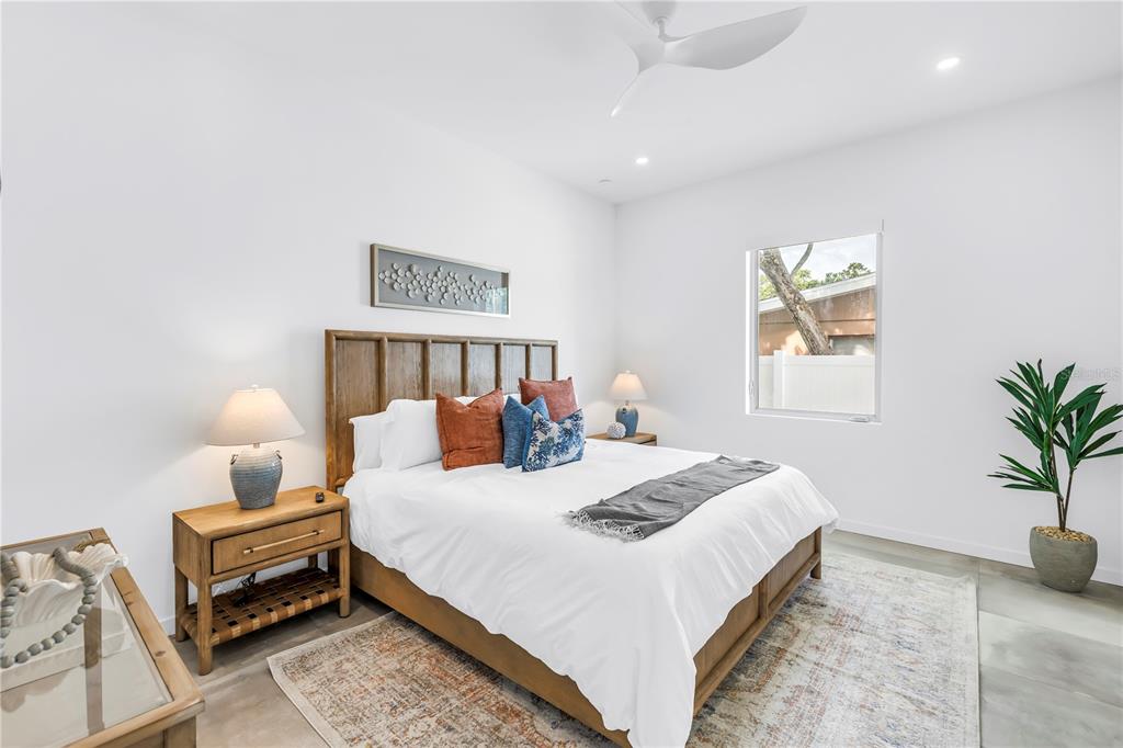 2314 Floyd Street Sarasota, FL 34239 - Photo 26 of 90 a bedroom with bed and a potted plant