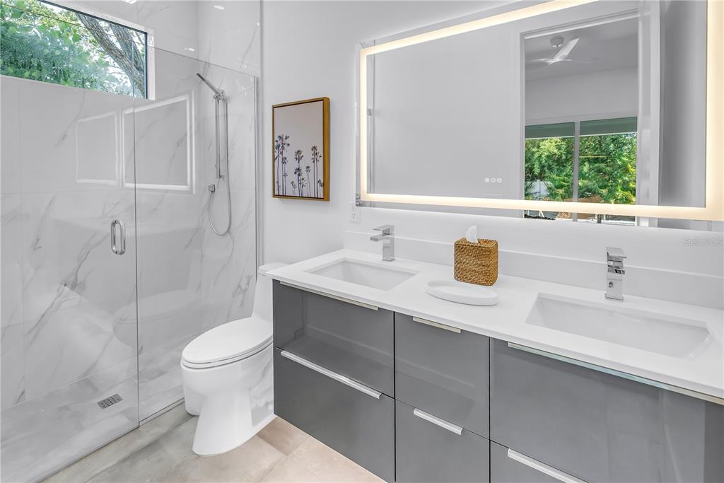 2314 Floyd Street Sarasota, FL 34239 - Photo 31 of 90 a bathroom with a sink toilet and shower