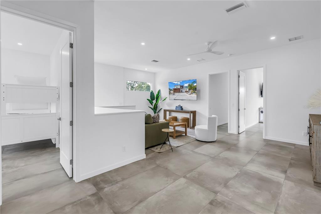 2314 Floyd Street Sarasota, FL 34239 - Photo 37 of 90 a living room with furniture and a refrigerator