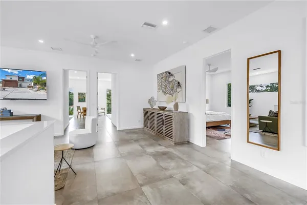 a view of a porch with furniture and garden