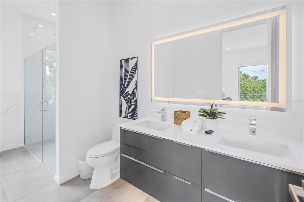 2314 Floyd Street Sarasota, FL 34239 - Photo 44 of 90 a bathroom with a sink a toilet and shower