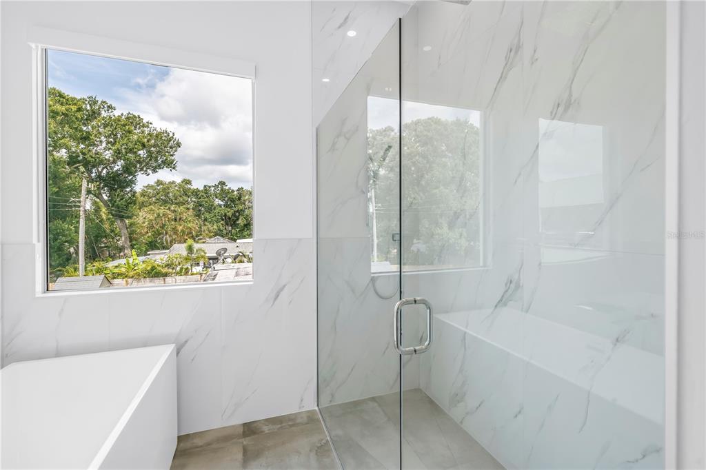 2314 Floyd Street Sarasota, FL 34239 - Photo 46 of 90 a bathroom with a bathtub and shower