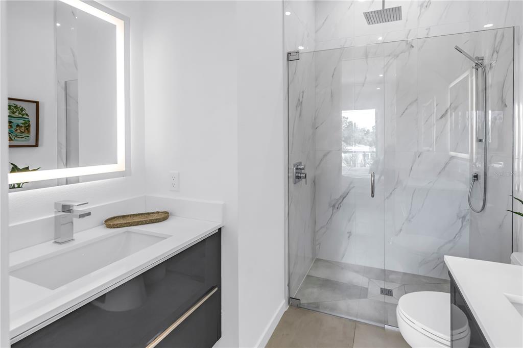 2314 Floyd Street Sarasota, FL 34239 - Photo 49 of 90 a bathroom with a sink a toilet and shower