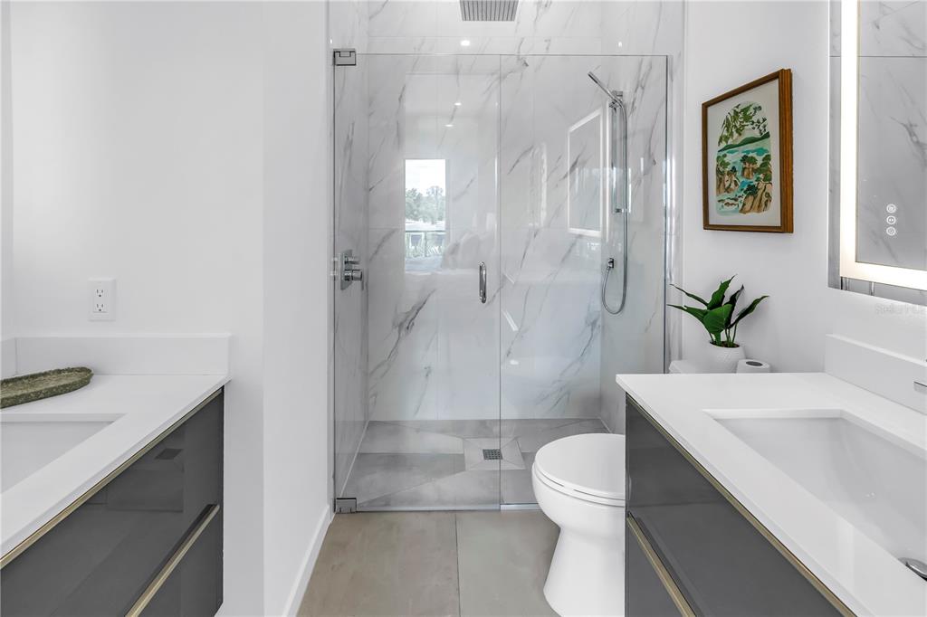 2314 Floyd Street Sarasota, FL 34239 - Photo 50 of 90 a bathroom with a sink a toilet and shower