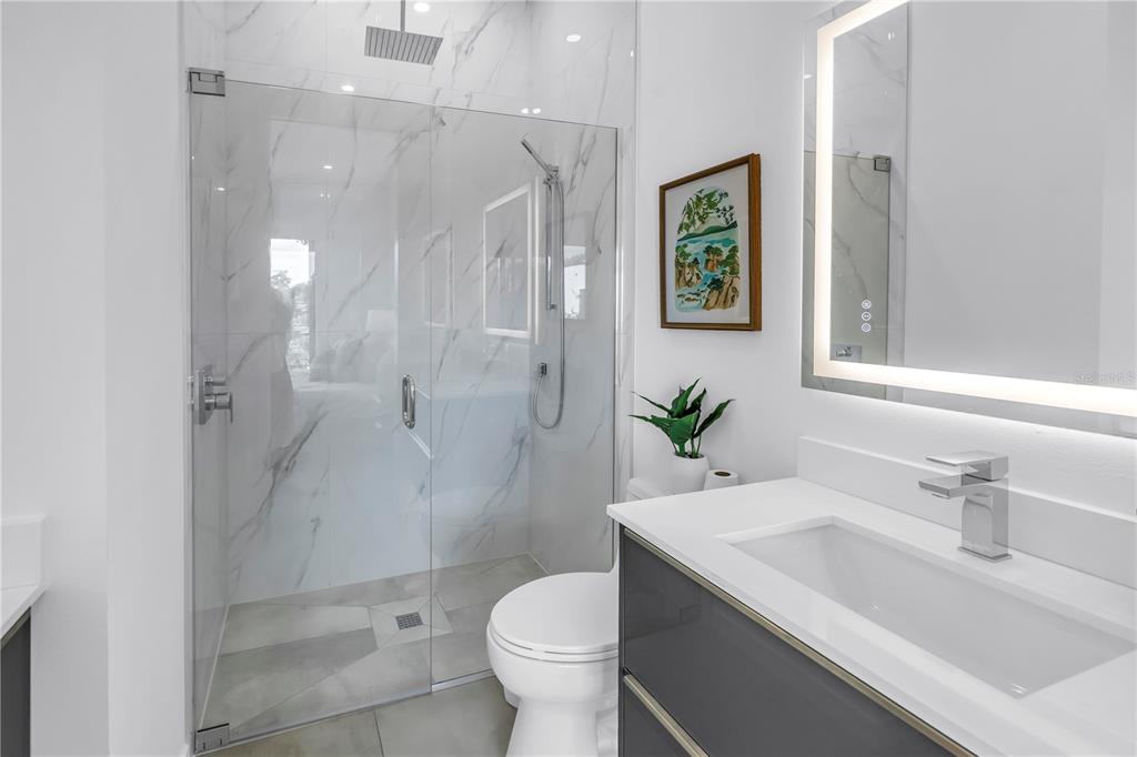 2314 Floyd Street Sarasota, FL 34239 - Photo 51 of 90 a bathroom with a sink toilet and shower