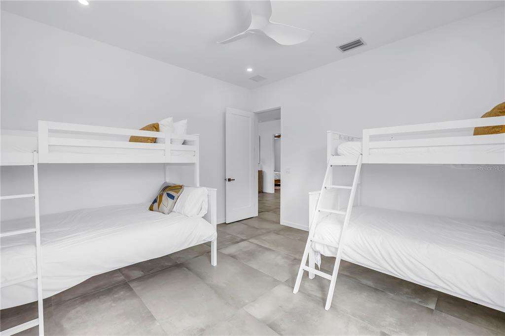 2314 Floyd Street Sarasota, FL 34239 - Photo 52 of 90 a bedroom with a bed and a cabinets