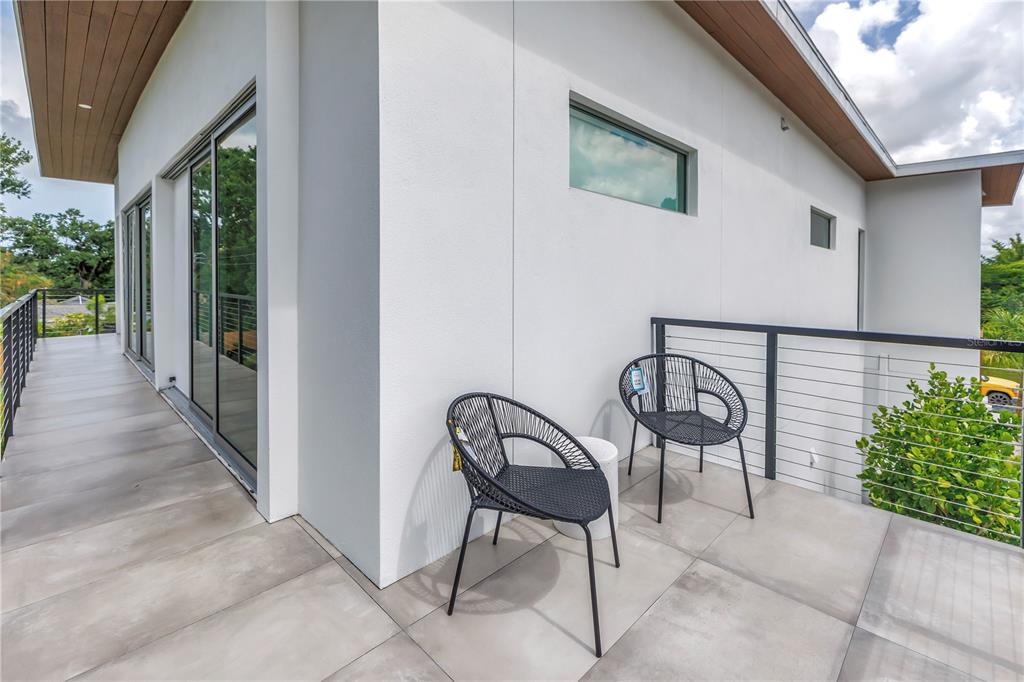 2314 Floyd Street Sarasota, FL 34239 - Photo 58 of 90 a view of a porch with furniture and garden