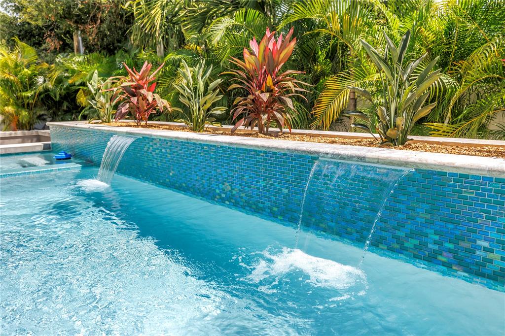 2314 Floyd Street Sarasota, FL 34239 - Photo 70 of 90 a view of a yard with plants and wooden fence