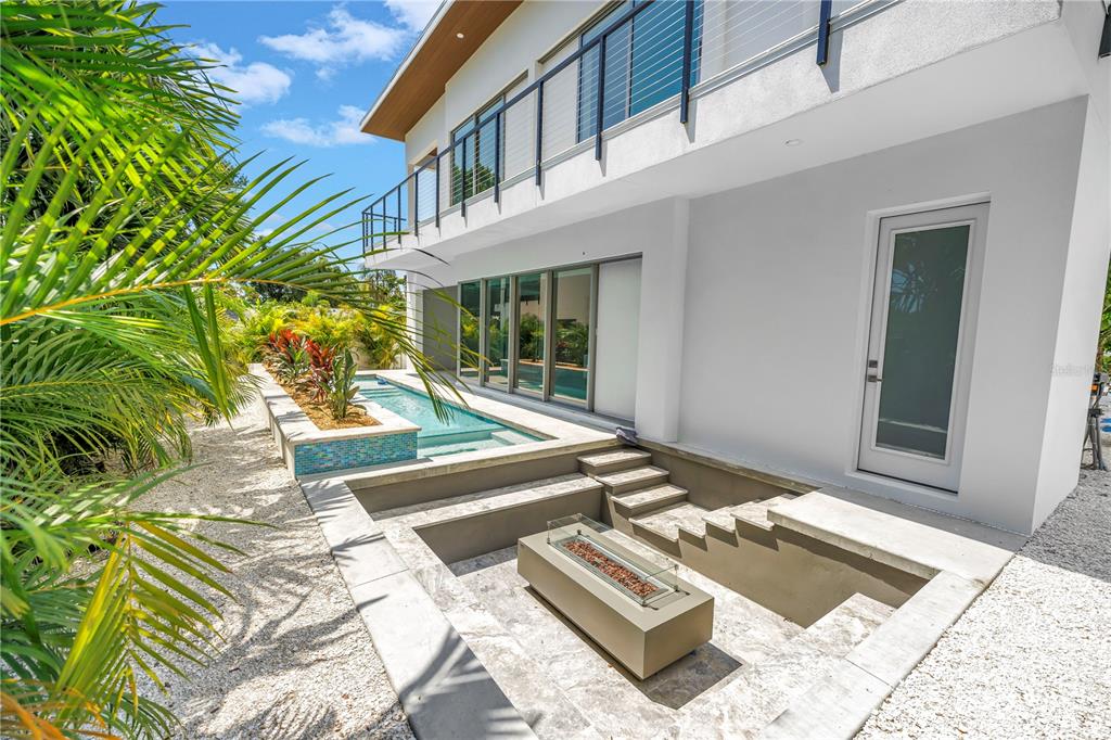 2314 Floyd Street Sarasota, FL 34239 - Photo 73 of 90 a view of a patio with a table and chairs and potted plants